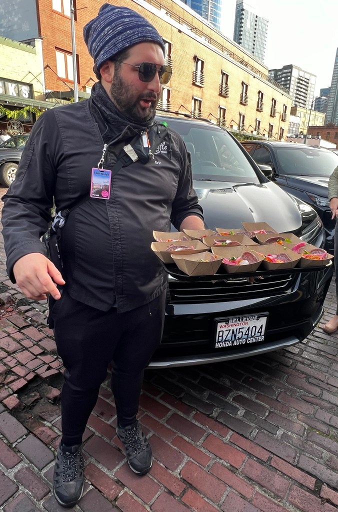 Chef Eric hands out samples from Maia at Pike Market Place in Seattle. Image by JAG.