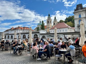 Ljubljana, Slovenia's riverbank cafes are perfect for sipping coffee and people watching.