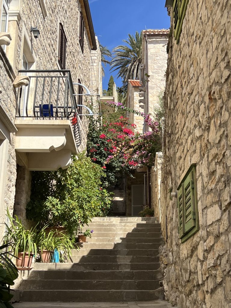 Steps leading to the Fortica in Hvar town in Croatia at the top of the hill .